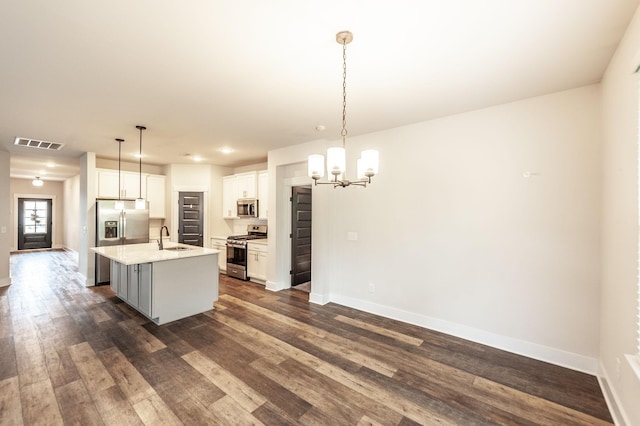 224 Griffin Ln, Gallatin, TN 37066 - kitchen with visible vents, appliances with stainless steel finishes, a sink, baseboards, and a notable chandelier