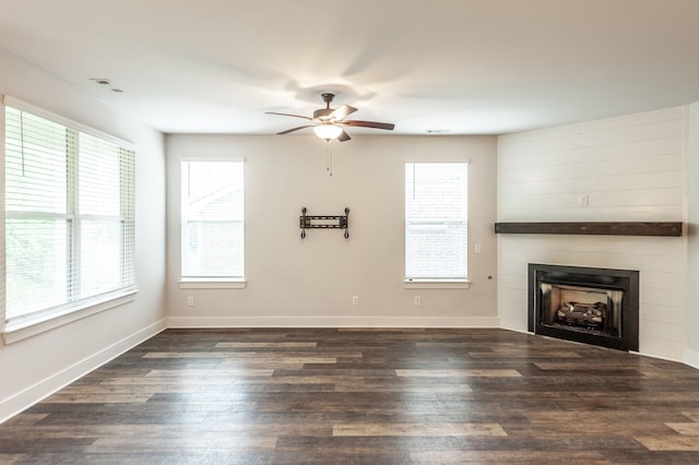 224 Griffin Ln, Gallatin, TN 37066 - unfurnished living room with a healthy amount of sunlight, ceiling fan, a large fireplace, and wood finished floors