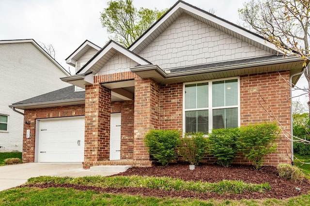 224 Griffin Ln, Gallatin, TN 37066 - view of front facade with a garage, roof with shingles, brick siding, and concrete driveway