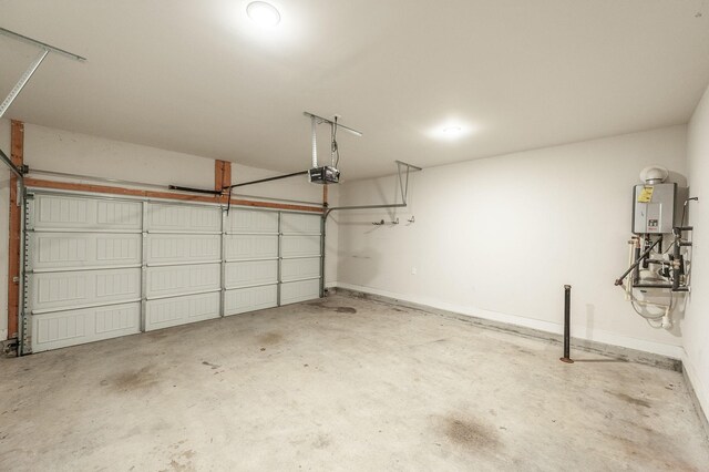 224 Griffin Ln, Gallatin, TN 37066 - garage with a garage door opener, baseboards, and tankless water heater