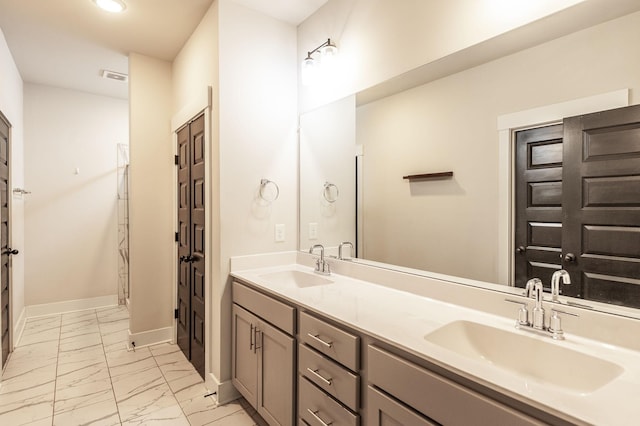 224 Griffin Ln, Gallatin, TN 37066 - full bath with baseboards, visible vents, marble finish floor, and a sink