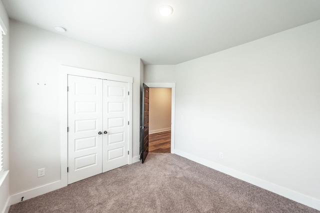 224 Griffin Ln, Gallatin, TN 37066 - unfurnished bedroom featuring a closet, carpet flooring, and baseboards