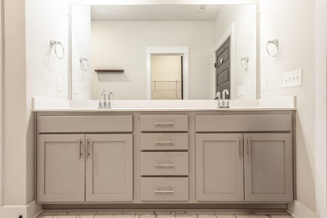 224 Griffin Ln, Gallatin, TN 37066 - bathroom featuring a sink, baseboards, and double vanity