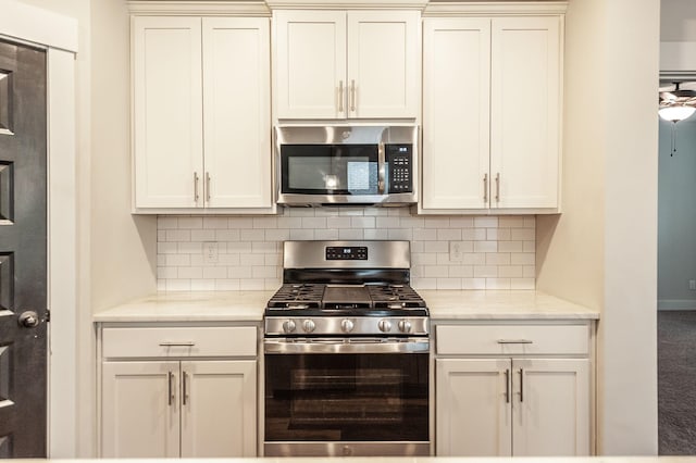 224 Griffin Ln, Gallatin, TN 37066 - kitchen featuring tasteful backsplash, light stone counters, and appliances with stainless steel finishes