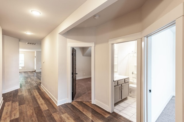 224 Griffin Ln, Gallatin, TN 37066 - corridor featuring baseboards, dark wood finished floors, and visible vents
