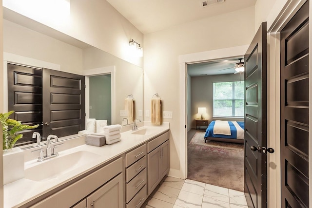 224 Griffin Ln, Gallatin, TN 37066 - bathroom with a sink, ceiling fan, double vanity, and marble finish floor