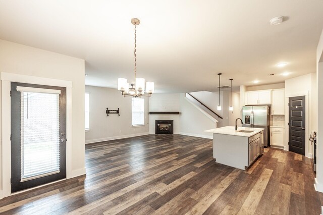 224 Griffin Ln, Gallatin, TN 37066 - kitchen with dark wood-type flooring, open floor plan, a sink, and stainless steel fridge