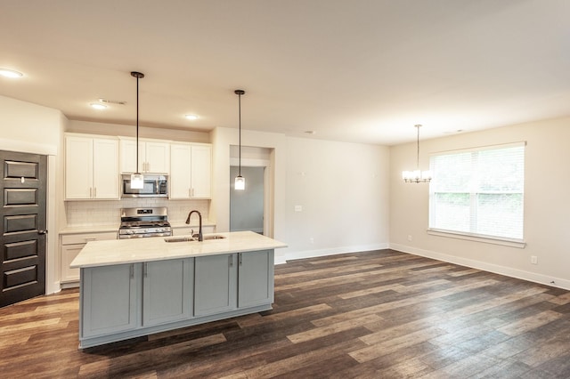 224 Griffin Ln, Gallatin, TN 37066 - kitchen with tasteful backsplash, dark wood-style flooring, a sink, and appliances with stainless steel finishes