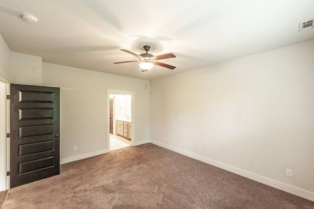 224 Griffin Ln, Gallatin, TN 37066 - spare room featuring visible vents, ceiling fan, light colored carpet, and baseboards