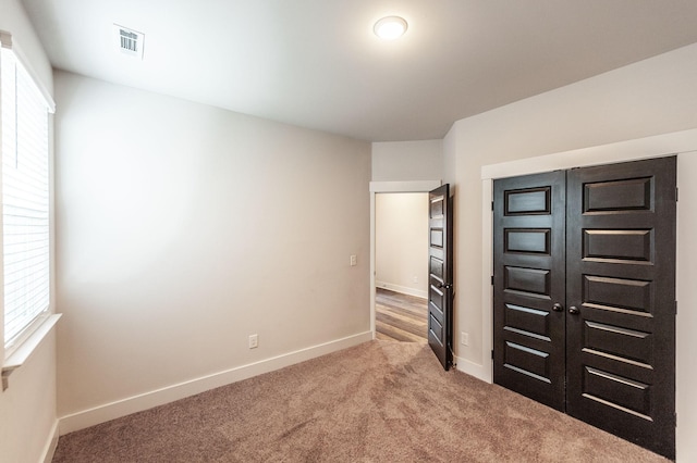 224 Griffin Ln, Gallatin, TN 37066 - unfurnished bedroom with carpet, visible vents, baseboards, and multiple windows