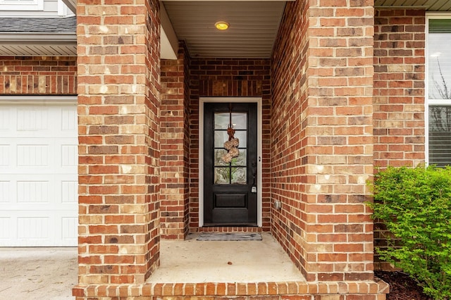 224 Griffin Ln, Gallatin, TN 37066 - view of exterior entry featuring roof with shingles and brick siding