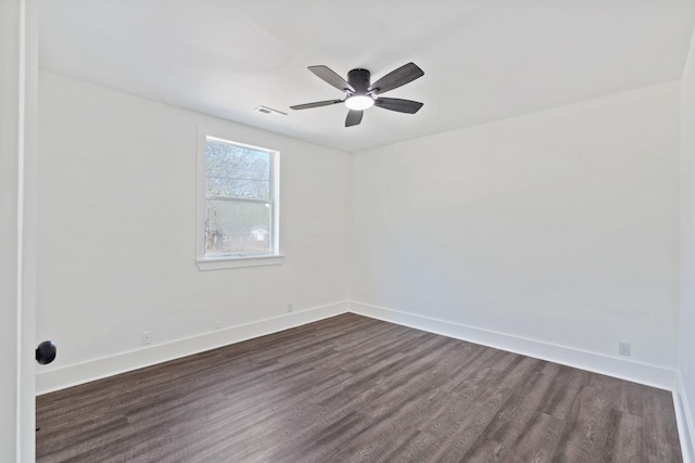 unfurnished room featuring visible vents, ceiling fan, baseboards, and dark wood finished floors