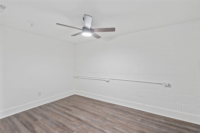 unfurnished room featuring visible vents, baseboards, a ceiling fan, and dark wood finished floors