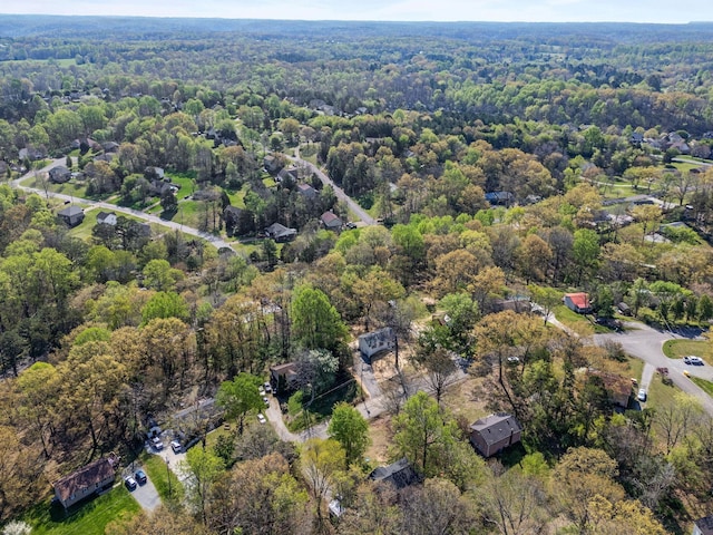drone / aerial view featuring a view of trees