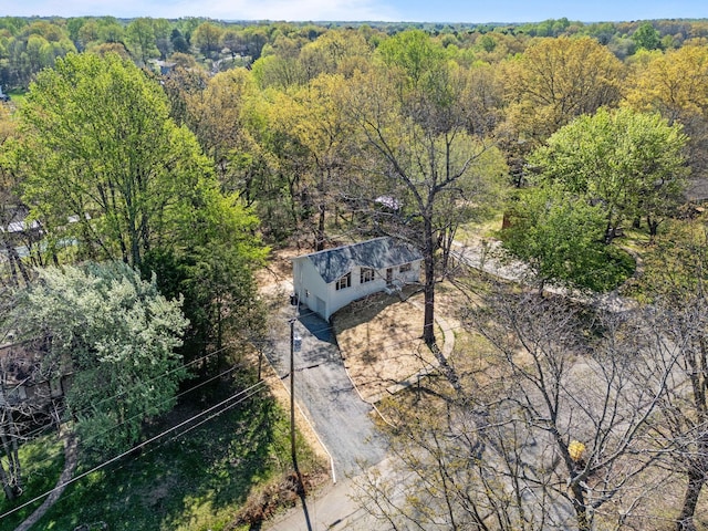 aerial view with a wooded view