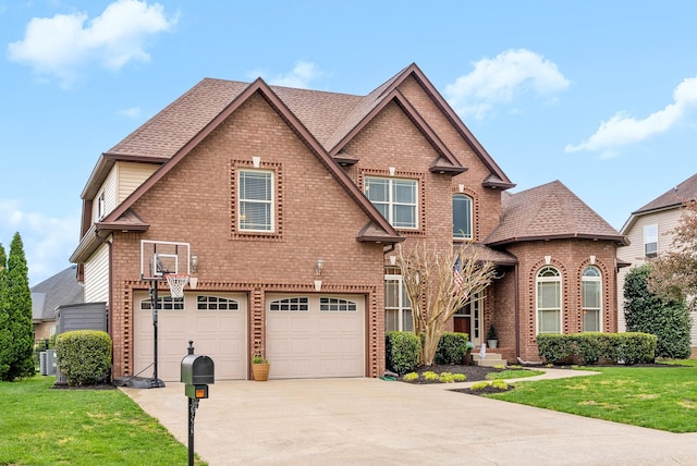 view of front of property with a front yard, brick siding, a garage, and concrete driveway