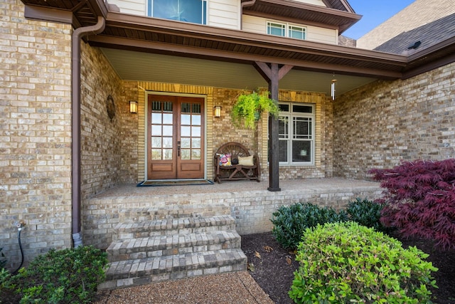 113 St Charles Way, Gallatin, TN 37066 - doorway to property featuring covered porch, french doors, and brick siding