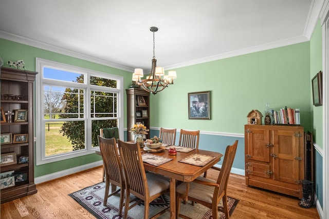 113 St Charles Way, Gallatin, TN 37066 - dining room featuring ornamental molding, a chandelier, light wood-style floors, and baseboards