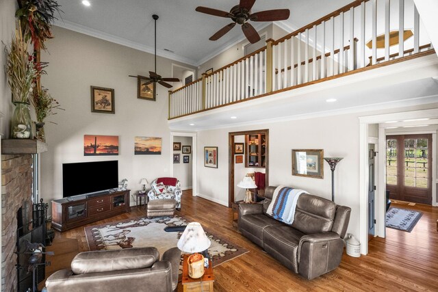 113 St Charles Way, Gallatin, TN 37066 - living area featuring a ceiling fan, a high ceiling, wood finished floors, crown molding, and baseboards