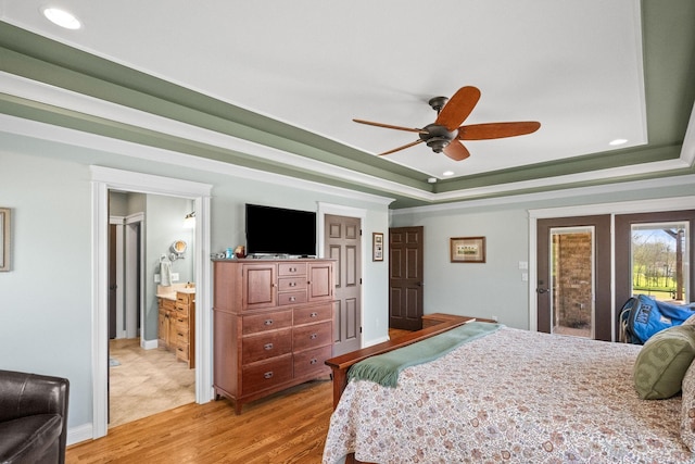 113 St Charles Way, Gallatin, TN 37066 - bedroom with light wood-type flooring, a tray ceiling, recessed lighting, a ceiling fan, and connected bathroom