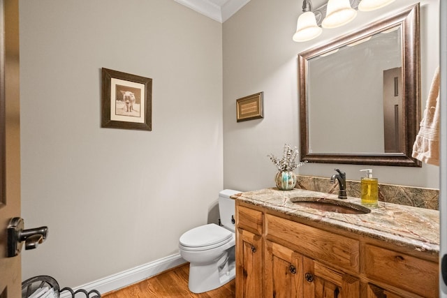 113 St Charles Way, Gallatin, TN 37066 - half bath with ornamental molding, wood finished floors, baseboards, toilet, and vanity
