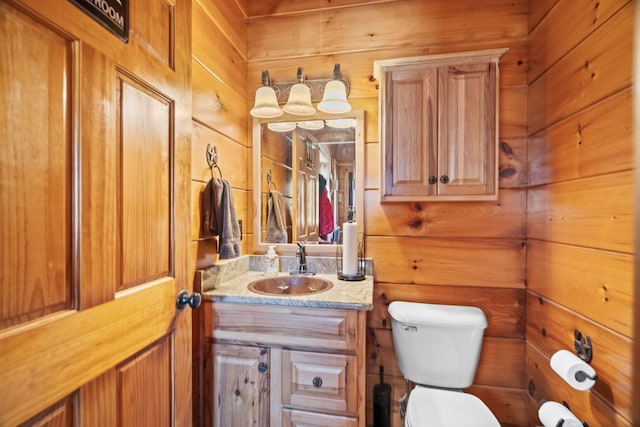 113 St Charles Way, Gallatin, TN 37066 - bathroom with toilet, vanity, and wooden walls