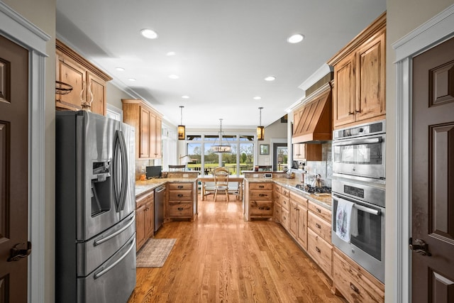 113 St Charles Way, Gallatin, TN 37066 - kitchen featuring appliances with stainless steel finishes, a peninsula, recessed lighting, light wood-style flooring, and pendant lighting