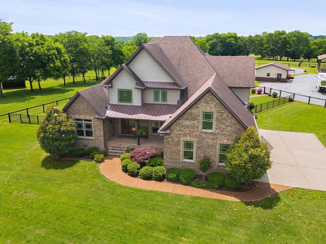 113 St Charles Way, Gallatin, TN 37066 - view of front of property featuring covered porch, brick siding, metal roof, and a standing seam roof