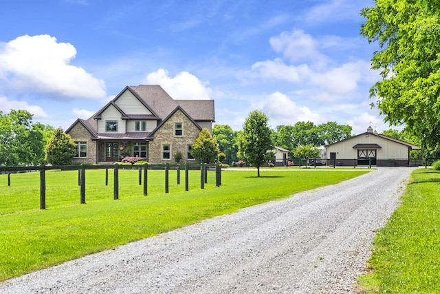 113 St Charles Way, Gallatin, TN 37066 - craftsman-style house featuring stone siding, a standing seam roof, metal roof, and a detached garage