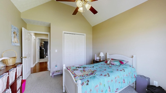 bedroom with a closet, ceiling fan, high vaulted ceiling, and carpet flooring