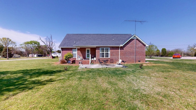 back of house with crawl space, a yard, and brick siding