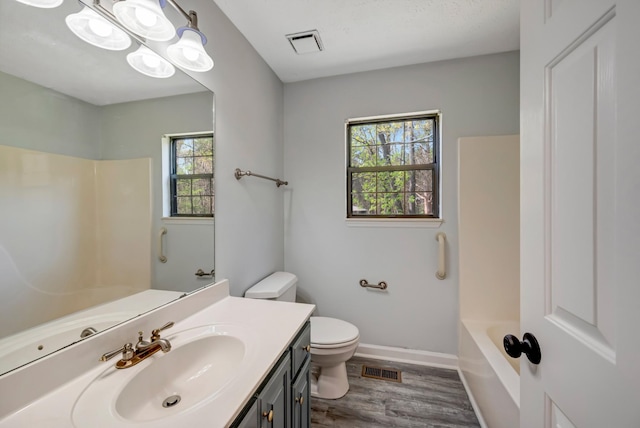 308 Wareham Ct, Antioch, TN 37013 - full bath with toilet, visible vents, a wealth of natural light, and wood finished floors