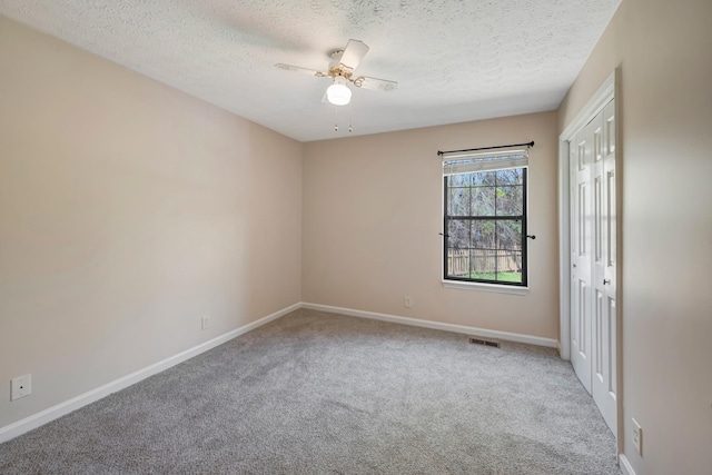 308 Wareham Ct, Antioch, TN 37013 - unfurnished room featuring a textured ceiling, visible vents, ceiling fan, and carpet