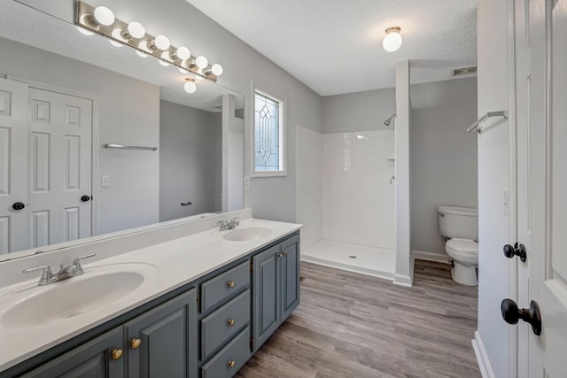 308 Wareham Ct, Antioch, TN 37013 - bathroom with a sink, toilet, a tile shower, and double vanity