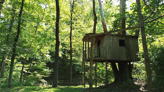 view of outdoor structure featuring a wooded view