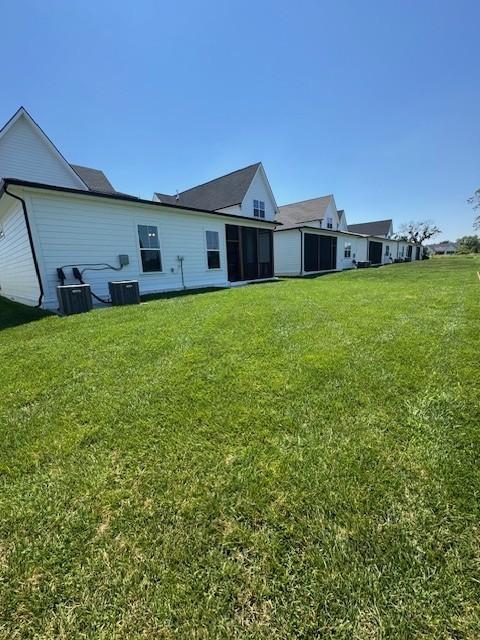 5818 Willoughby Way, Murfreesboro, TN 37129 - back of property with a yard and a sunroom