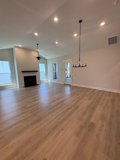 5818 Willoughby Way, Murfreesboro, TN 37129 - unfurnished living room with a fireplace, wood finished floors, vaulted ceiling, ceiling fan, and recessed lighting
