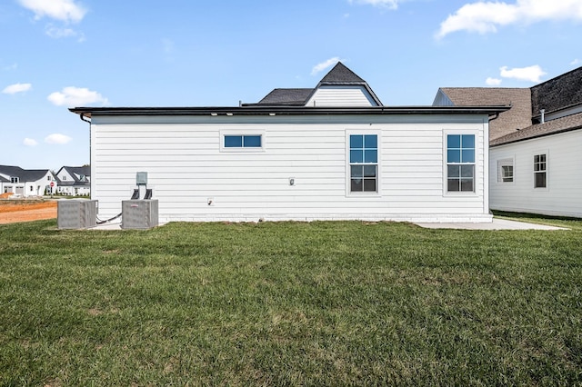 back of house with a yard