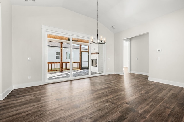 interior space featuring an inviting chandelier, visible vents, dark wood-style flooring, baseboards, and vaulted ceiling