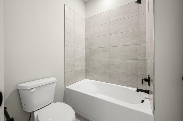 full bathroom featuring washtub / shower combination and toilet