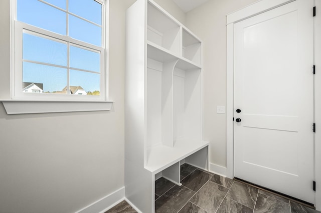 mudroom featuring baseboards and marble finish floor
