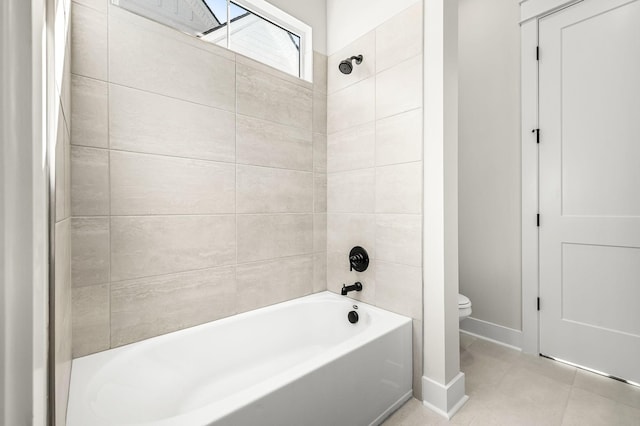 full bathroom featuring baseboards, tile patterned floors, toilet, and shower / tub combination