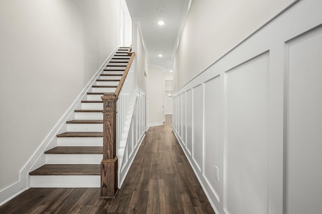 staircase with recessed lighting, baseboards, and wood finished floors