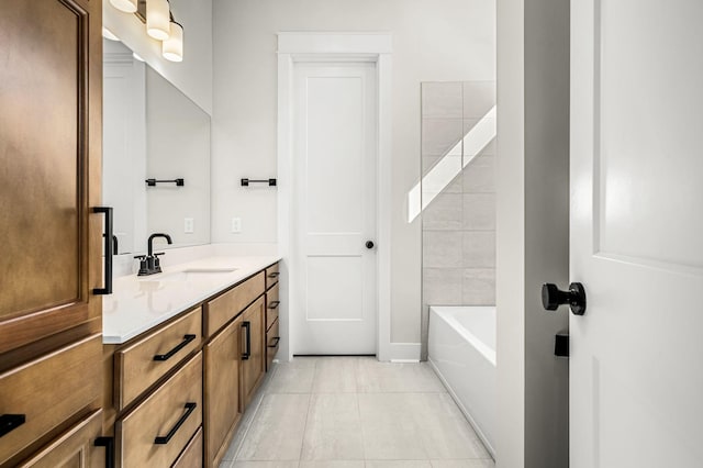 bathroom featuring tile patterned flooring and vanity