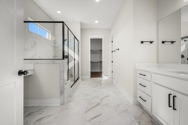 bathroom featuring baseboards, recessed lighting, a marble finish shower, and marble finish floor