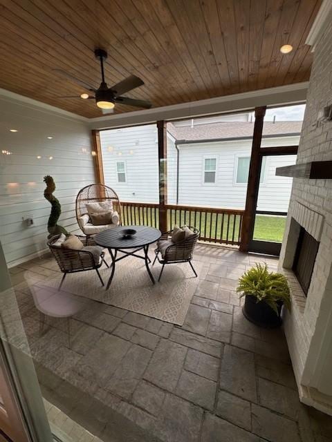 5739 Sagebrush Dr, Murfreesboro, TN 37129 - sunroom with an outdoor brick fireplace and a ceiling fan