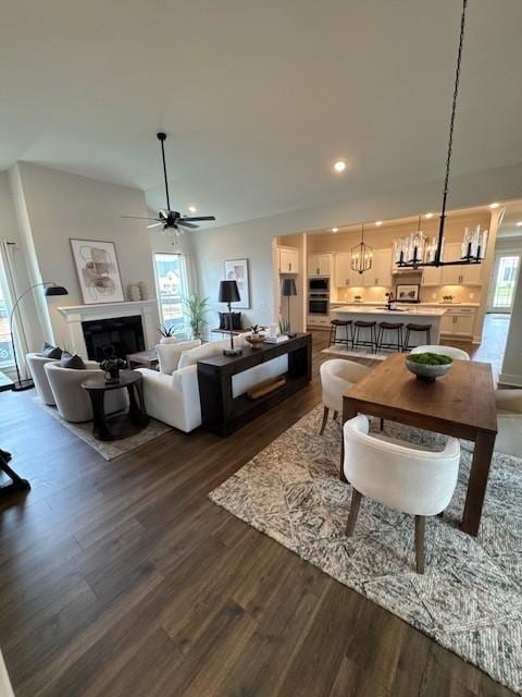 5739 Sagebrush Dr, Murfreesboro, TN 37129 - living area with a chandelier, dark wood-style floors, ceiling fan, recessed lighting, and a fireplace