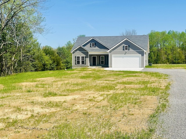 2240 Eugene Reed Rd, Woodbury, TN 37190 - view of front facade with a garage, a front yard, and dirt driveway