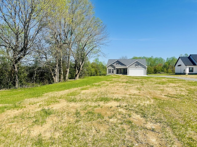 2240 Eugene Reed Rd, Woodbury, TN 37190 - view of yard with an attached garage and driveway