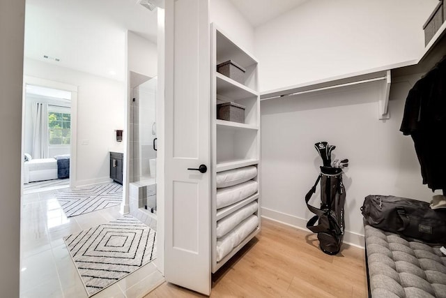 walk in closet featuring visible vents and light wood-style flooring